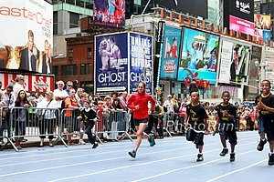 Desi Davila Races Kids in Times Square