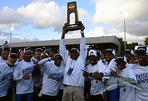 Jun 10, 2016; Eugene, OR, USA; Florida Gators coach Mike Holloway hoists the national champion trophy after the Gators won the men's team title during the 2016 NCAA Track and Field championships at Hayward Field.