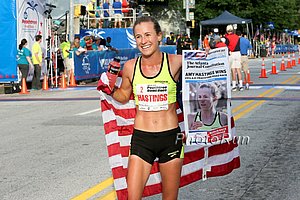 Amy Hastings celebrating her 2014 Peachtree win. *2014 AJCPeachtree Photos