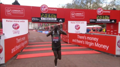 Kipchoge tries to hide his frustration at coming eight seconds short of the WR 