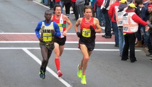 Leonard Korir, Chris Thompson and Ben True setting up for the final sprint of the 2016 Manchester Road Race (photo by David Monti for Race Results Weekly)
