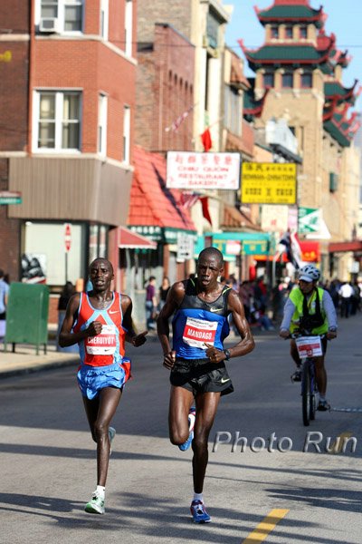 Cheruiyot-Mandago1a-#2A4063.jpg