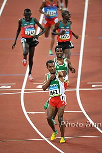 Bekele_KenenisaPose_#1C82CE.jpg