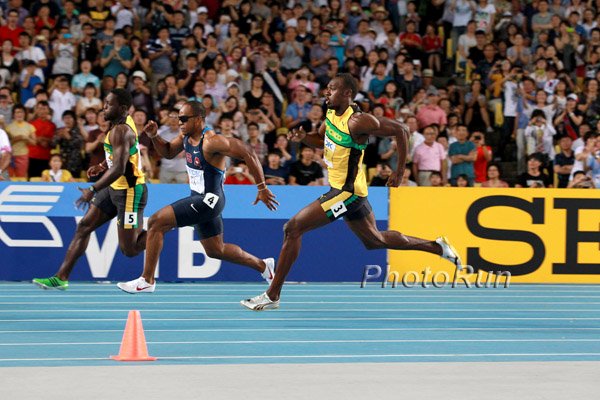 Walter Dix (l) and Usain Bolt (r)
