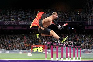 Robert Harting Celebrates by Hurdling Hurdles