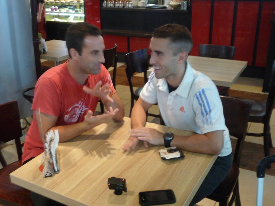 Lohr and Fenton filming while waiting for their coffees