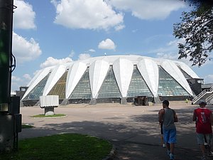This is some sort of stadium but it is being used as the place you pick up your media pass