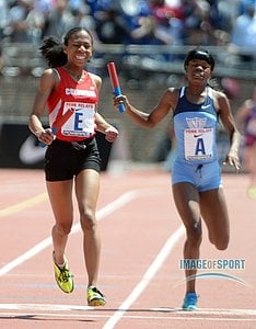 Olivia Baker of Columbia (E) celebrates after passing Asshanni Robb of Edwin Allen (A) on the anchor of the Championship of America 4 x 800m girls relay
