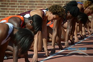 Olivia Ekpone of Texas A&M (center) in the starting blocks a womens 100m heat