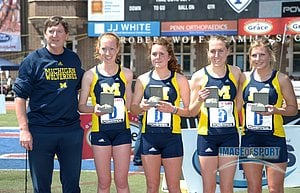 Michigan womens 4 x 1,500m relay team. Coach Mike McGuire, Amanda Eccleston and Rebecca Addison and Jillian Smith and Shannon Osika.