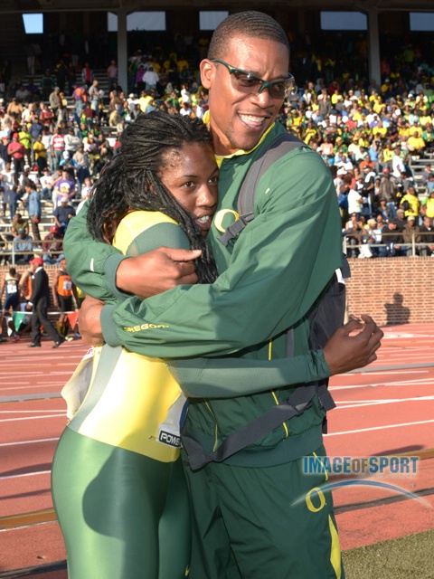 Oregon Ducks coach Robert Johnson (right) embraces Chizoba Okodogbe after the Ducks set a meet record of 3:26.73 in the Championship of America womens 4 x 400m relay