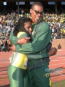 Oregon Ducks coach Robert Johnson (right) embraces Chizoba Okodogbe after the Ducks set a meet record of 3:26.73 in the Championship of America womens 4 x 400m relay