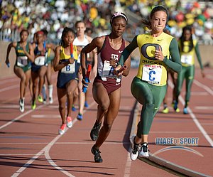 Laura Roesler of Oregon leads LaKeidra Stewart of Texas A&M on the third leg of the Championship of America womens 4 x 400m relay in the 119th Penn Relays at Franklin Field. Oregon won in a meet record 3:26.73.