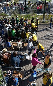 Spectators pass through security