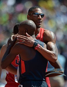 Duane Solomon and Bernard Lagat embrace at the end of the USA vs The World DMR