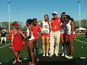 Cornell's victorious women's 4 x 400 with coaches Adrian Durant and RIch Bowman