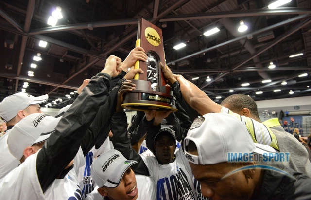 Mar 15, 2014; Albuquerque, NM, USA; Members of the Oregon mens team and coach Robert Johnson hoist the championship trophy after winning the team title in the 2014 NCAA Indoor Championships at Albuquerque Convention Center.