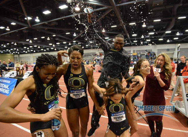 Mar 15, 2014; Albuquerque, NM, USA; Members of the Oregon womens 4 x 400m relay are doused by a bottle of water by Michael Berry after winning in a collegiate record 3:27.40 in the 2014 NCAA Indoor Championships at Albuquerque Convention Center. From left: Chizoba Okodogbe and Phyllis Francis and Christian Brennan and Laura Roesler.