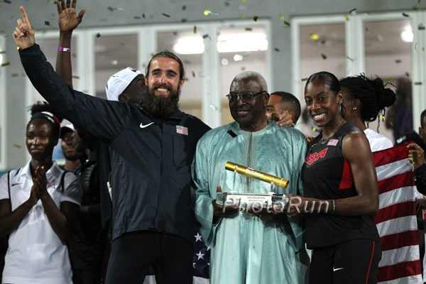 Will Leer and Chanelle Price with the Golden Baton from Lamine Diack