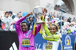 Lelisa Desisa and Caroline Rotich