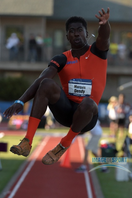 Marquis Dendy of Florida wins the long jump in a wind-aided 27-8
