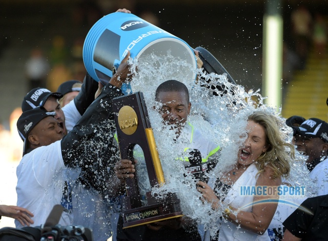 Jun 12, 2015; Eugene, OR, USA; Oregon Ducks coach Robert Johnson and ESPN broadcaster Jill Montgomery are doused after the Ducks won the mens team title in the 2015 NCAA Track & Field Championships at Hayward Field.
