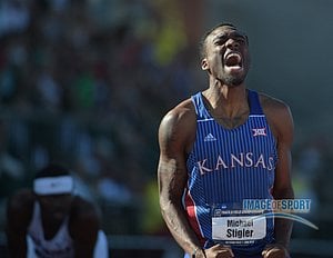 Jun 12, 2015; Eugene, OR, USA; Michael Stigler of Kansas celebrates after winning the 400m hurdles in 48.84 in the 2015 NCAA Track & Field Championships at Hayward Field.