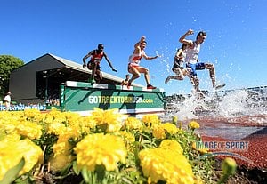 Jun 12, 2015; Eugene, OR, USA; Runners race over the water jump in the steeplechase in the 2015 NCAA Track & Field Championships at Hayward Field.