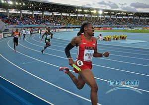 David Verburg runs the first leg on the United States heat-winning 4 x 400m relay
