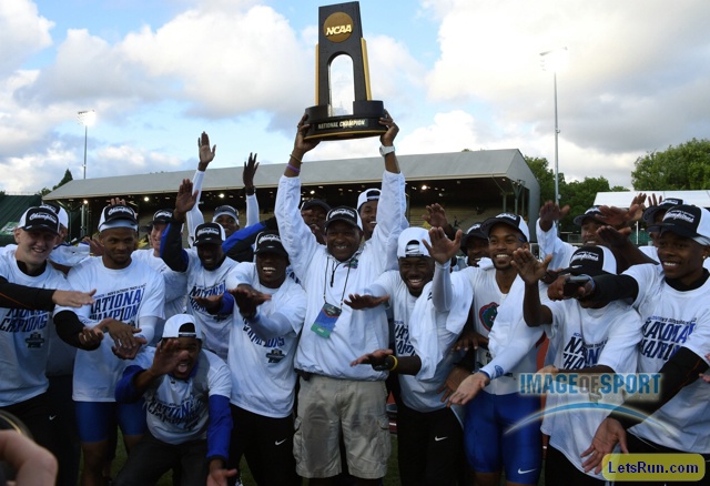Jun 10, 2016; Eugene, OR, USA; Florida Gators coach Mike Holloway hoists the national champion trophy after the Gators won the men's team title during the 2016 NCAA Track and Field championships at Hayward Field.