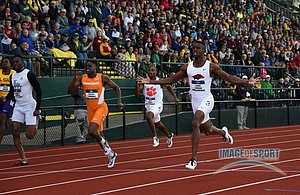Jarrion Lawson of Arkansas completes the triple ahead of Christian Coleman of Tennessee