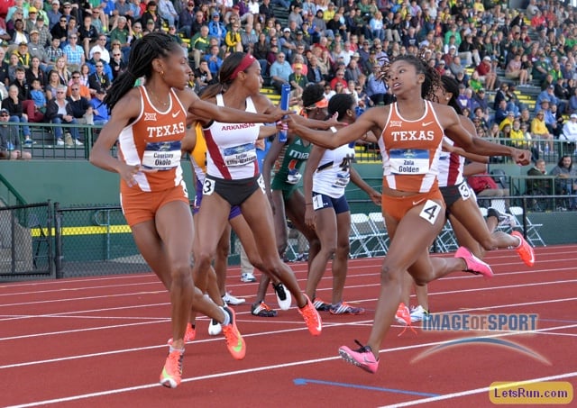 Courtney Okolo takes the handoff from Zola Golden on the anchor of the Texas women's 4 x 400m relay that won in 3:27.64