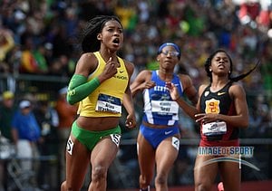 Ariana Washington of Oregon celebrates after winning the women's 100m in a wind-aided 10.95