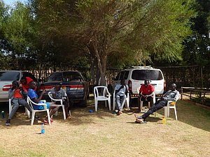 Runners Sitting outside in Shade waiting for run #2 of day