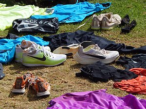 Shoes strewn about including Kipchoge's sub 2 shoes