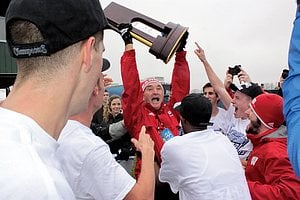 Mick Byrne Hoisting The 2011 NCAA Xc Trophy