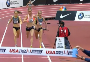 Chelsea Reilly (c.) running expertly down the middle/outside of lane one.