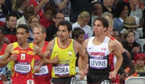 PHOTO: Cam Levins (far right) competing in the 2012 London Olympic 10,000m (photo by Jane Monti for Race Results Weekly)