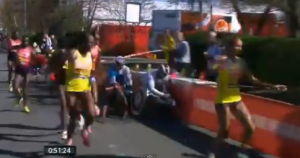 Tiki Gelana gets hit at the 2013 Virgin London Marathon