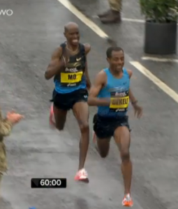 Kenenisa Bekele and Mo Farah battling with less than 10 seconds remaining