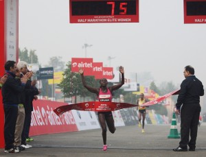 Florence Kiplagat wins in 68:00