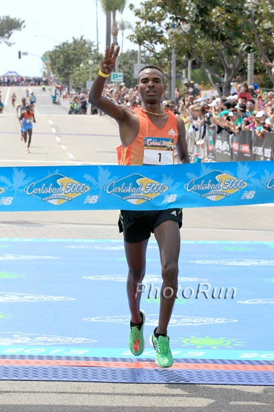 Dejen Gebremeskel celebrating his 3rd Carlsbad win last year *2013 Carlsbad Photos