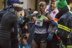 Mo Farah Coming To After Passing Out at NYC Half Full photo gallery here: http://www.letsrun.com/photos/2014/nyc-half/