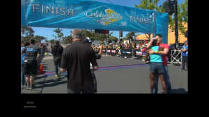 Marc Davis congratulates Bernard Lagat with a hug