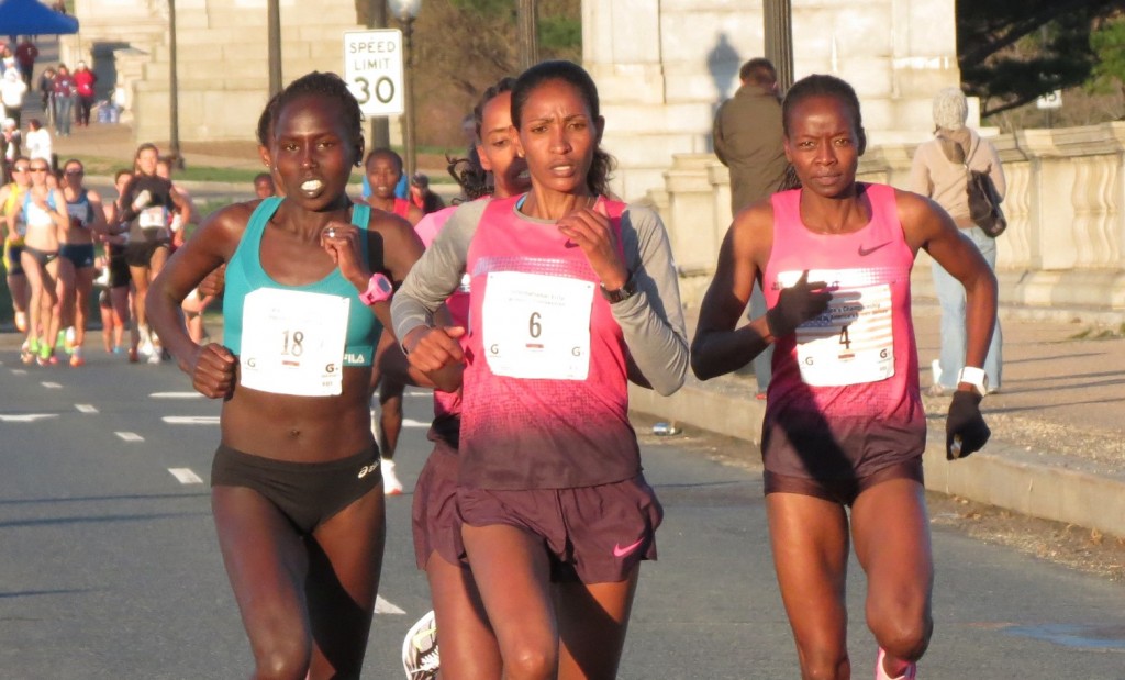 Aliphine Tuliamuk-Bolton, Mamitu Daska and Janet Bawcom lead field in the second mile of the 2014 Credit Union Cherry Blossom Ten Mile Run; Sara Hall and Makida Abdela are partially obscured behind them (photo by David Monti)