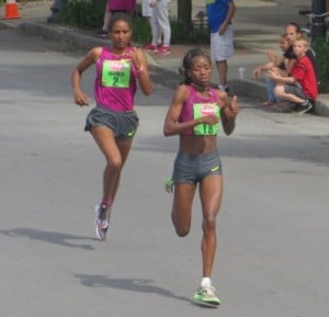 Lucy Kabuu of Kenya (r) sprints away from Mamitu Daska of Ethiopia to win the 2014 Freihofer's Run for Women 5-K in 15:20.1