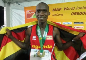 Joshua Cheptegei celebrates after winning the gold medal at 10,000m at the 2014 IAAF World Junior Championships (photo by Chris Lotsbom for Race Results Weekly)