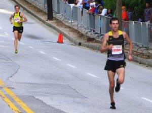 Christo Landry pulls away from Tyler Pennel. Photo by Chris Lotsbom.