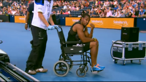 Yohan Blake is wheeled off the track in Glasgow in 2014