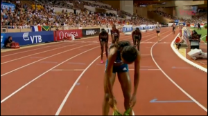 Molly Huddle Crosses Finish in Background for AR